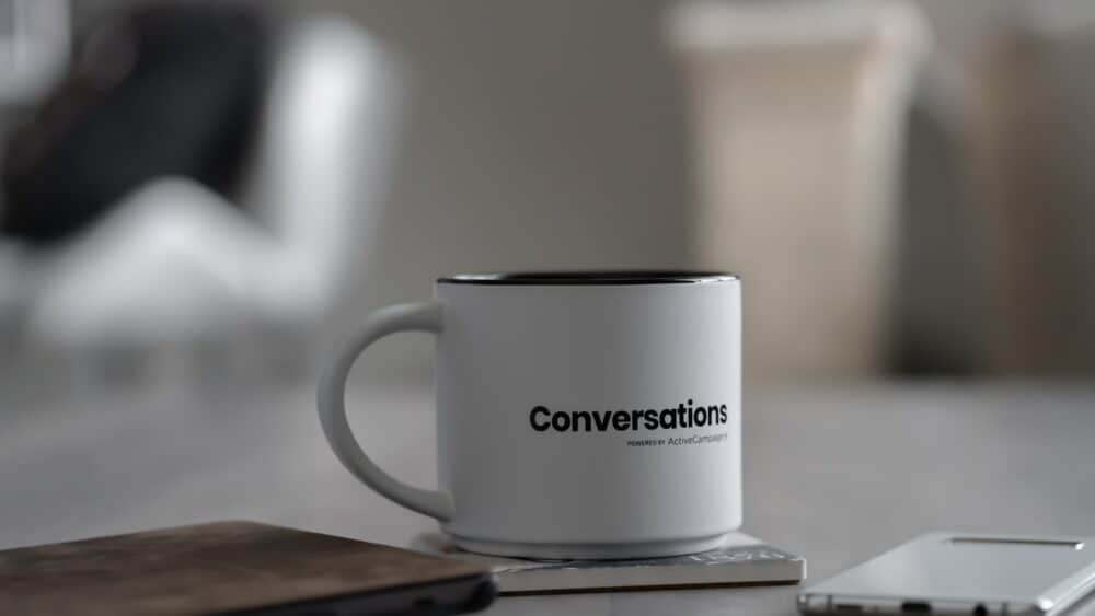 A coffee cup marked 'conversations'