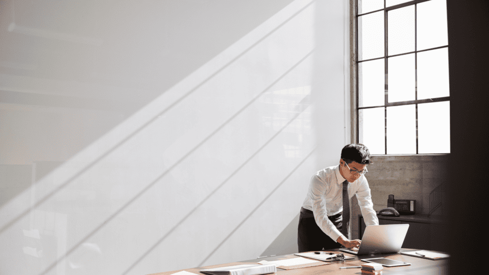 A professional man working alone in his office.