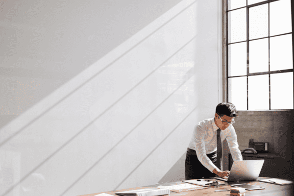 A professional man working alone in his office.